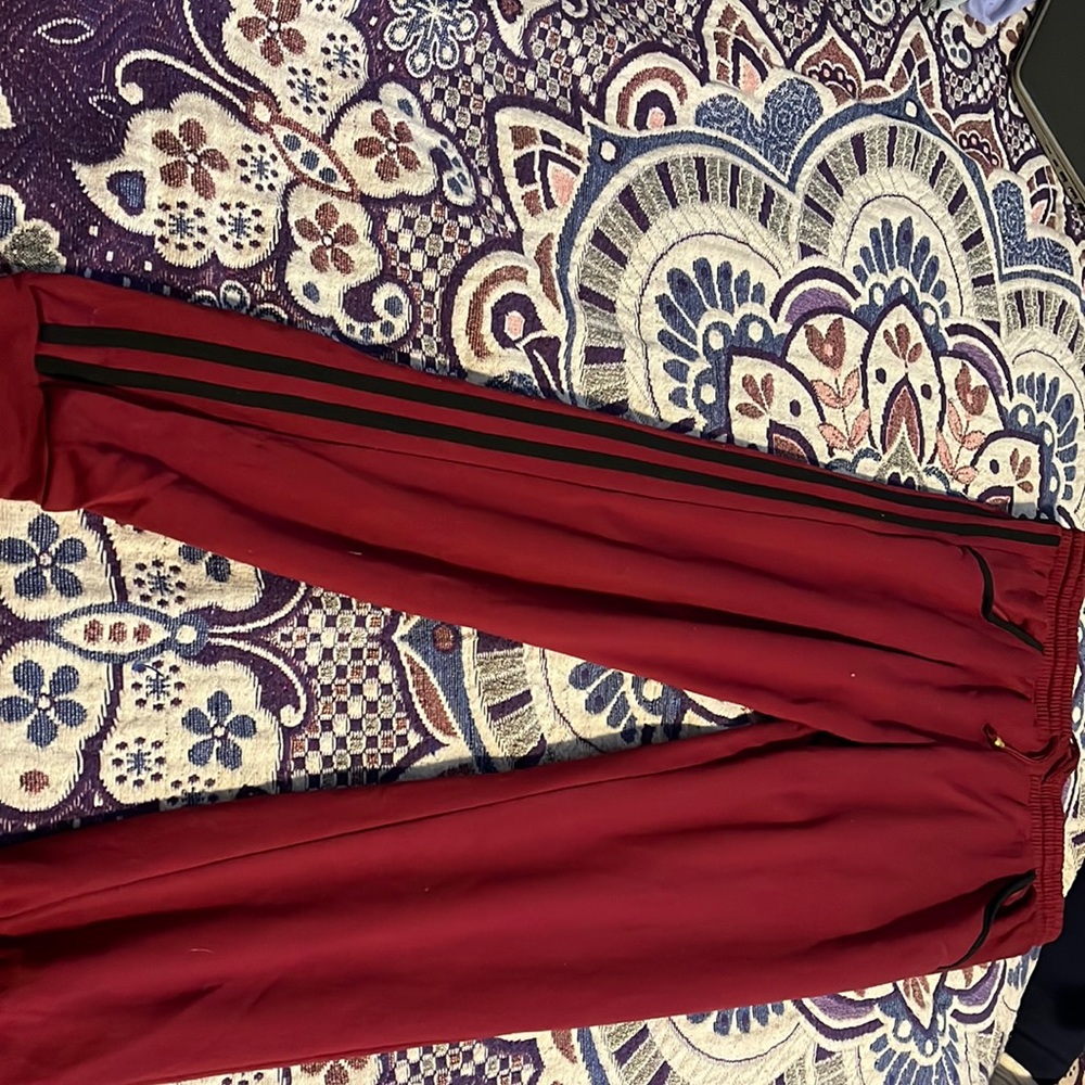 Burgundy sweat pants with 2 black lines on each side. Bae Side brand.